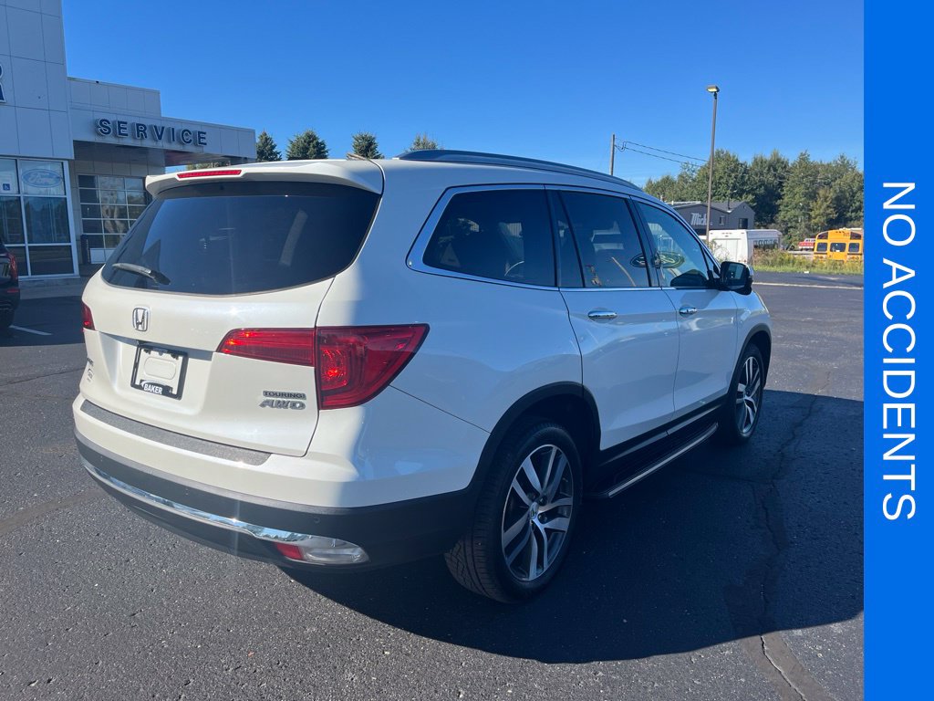 Used 2017 Honda Pilot Touring with VIN 5FNYF6H90HB104301 for sale in Ludington, MI