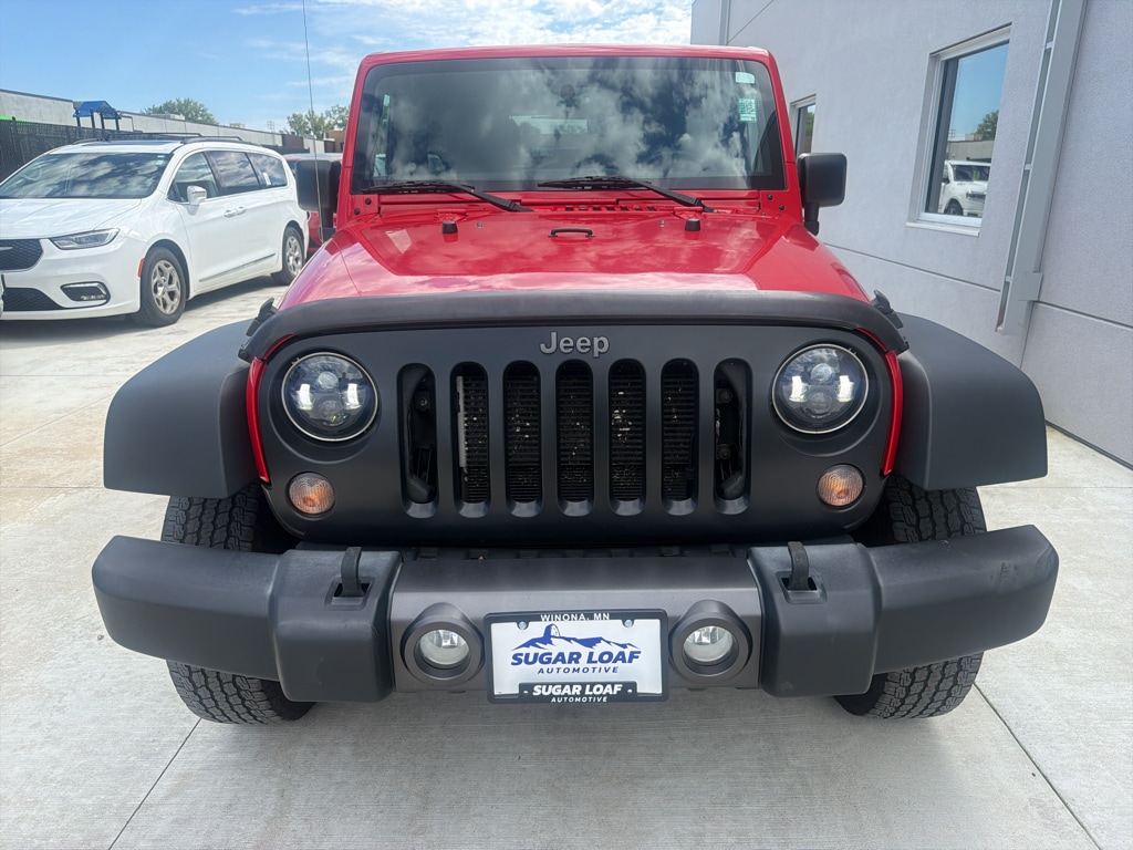 Used 2016 Jeep Wrangler Unlimited Black Bear with VIN 1C4BJWDG2GL166089 for sale in Winona, Minnesota