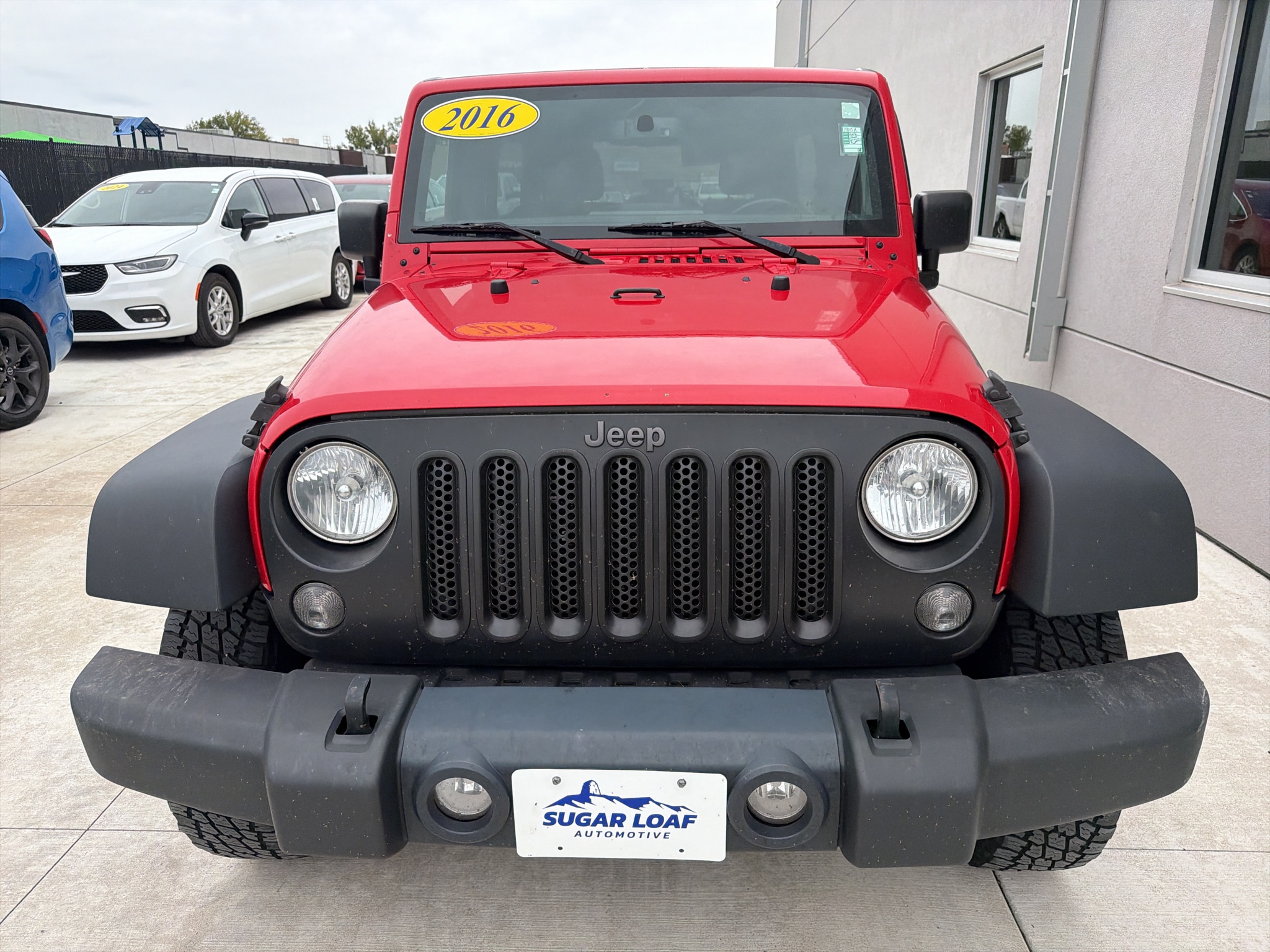 Used 2016 Jeep Wrangler Unlimited Black Bear with VIN 1C4BJWDG9GL135843 for sale in Winona, Minnesota