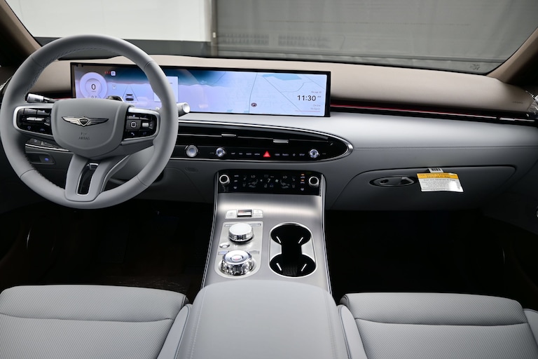 Wide dashboard display and center controls in a 2026 Genesis GV70