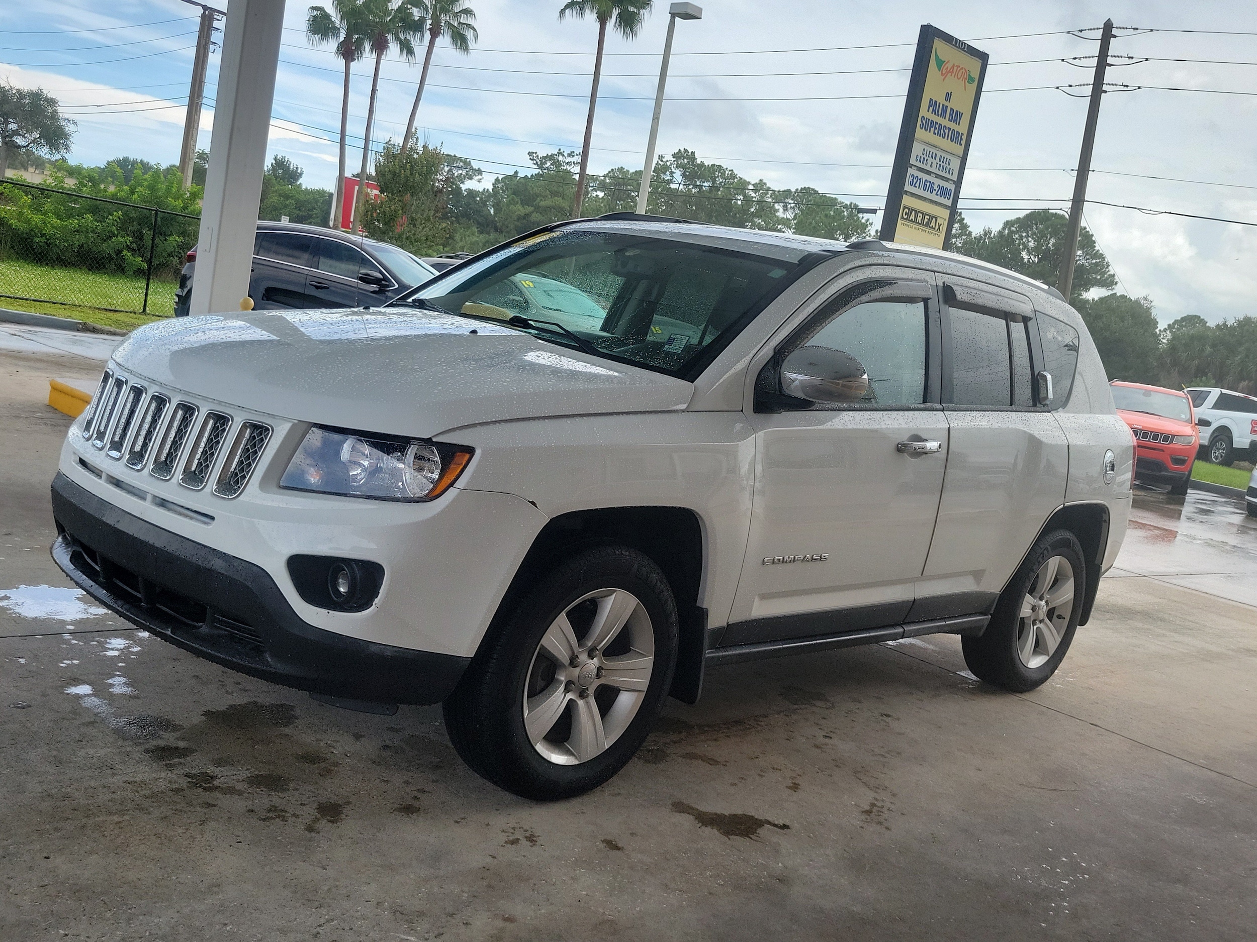 Used 2014 Jeep Compass Latitude with VIN 1C4NJCEB9ED779736 for sale in Melbourne, FL