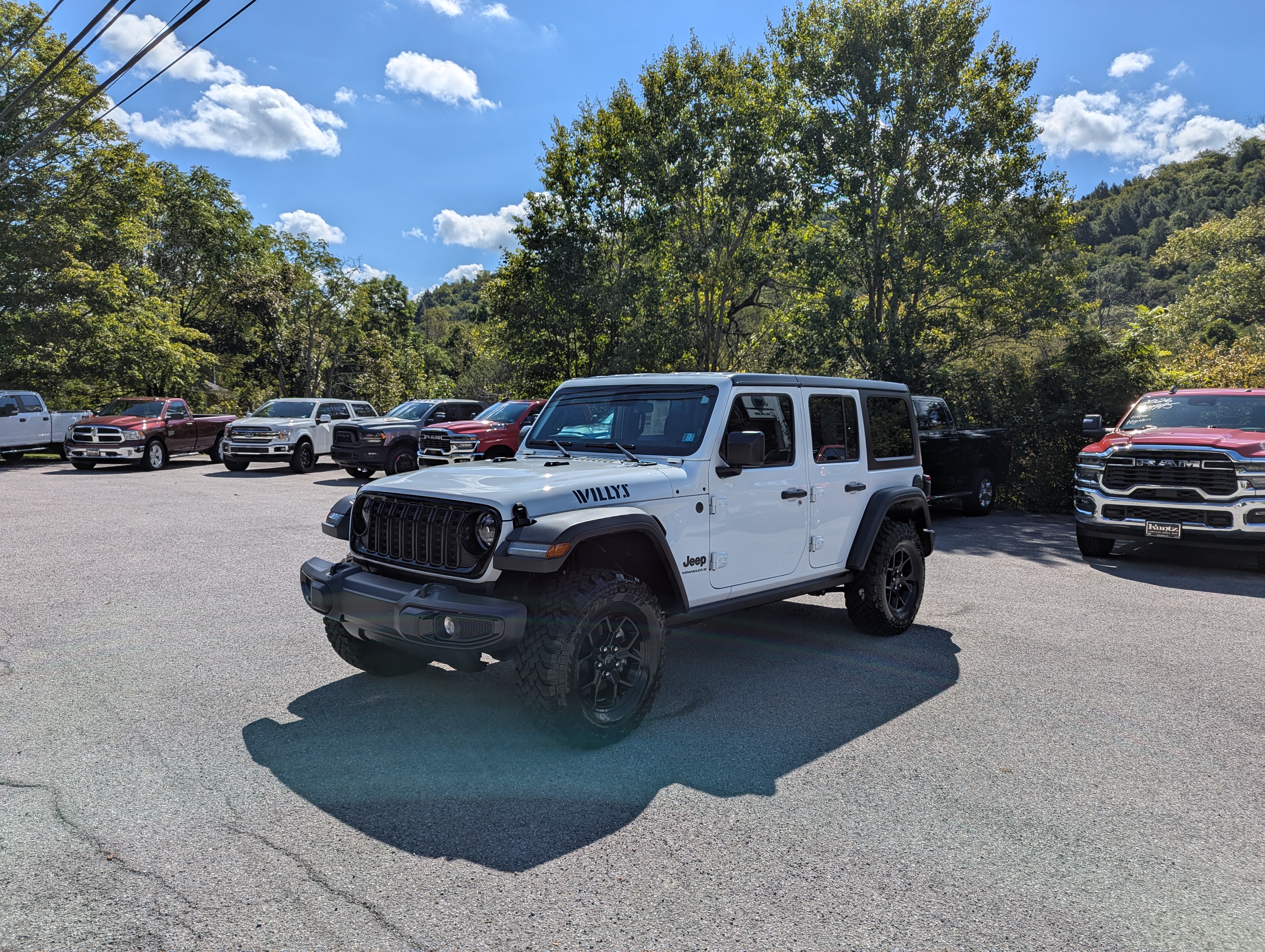 Featured Used 2025 Jeep Wrangler 4–DOOR WILLYS 4X4  SUV 1C4PJXDN0SW511637 for Sale in Mahaffey, PA