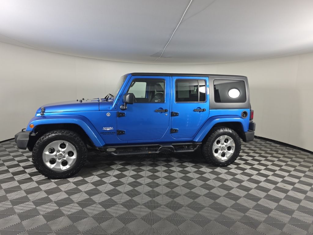 Used 2015 Jeep Wrangler Unlimited Sahara with VIN 1C4HJWEG5FL515589 for sale in Huntington, IN