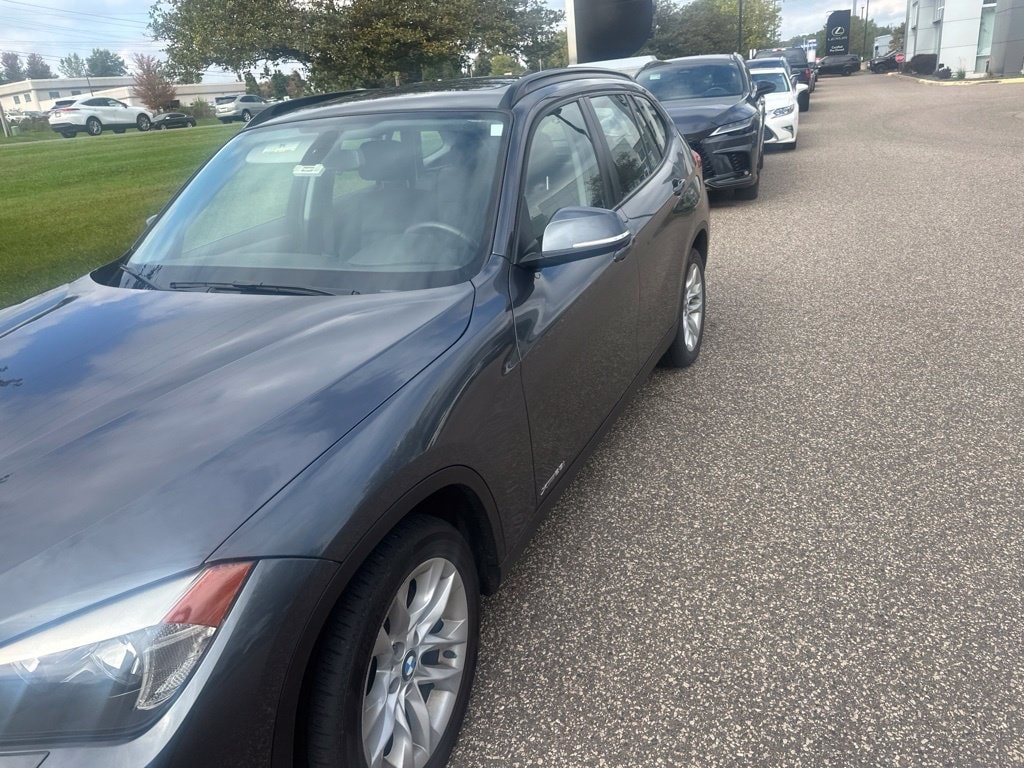 Used 2015 BMW X1 28i with VIN WBAVL1C54FVY39328 for sale in Maplewood, Minnesota