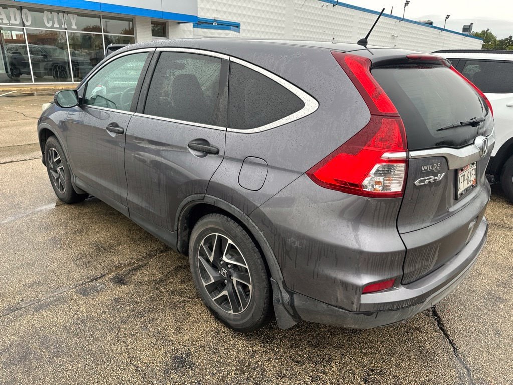 Used 2016 Honda CR-V SE with VIN 5J6RM4H47GL058698 for sale in Dubuque, IA
