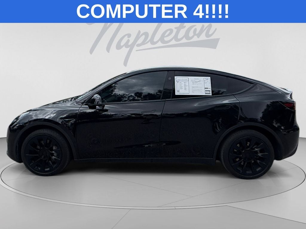 Used 2023 Tesla Model Y Base with VIN 7SAYGDED3PF960171 for sale in Orlando, FL
