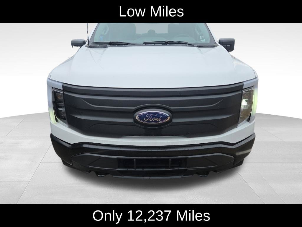 Used 2023 Ford F-150 Lightning Pro with VIN 1FTVW1ELXPWG39734 for sale in Lansing, MI