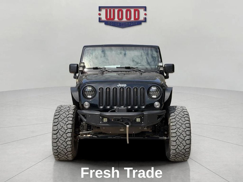 Used 2016 Jeep Wrangler Sport with VIN 1C4AJWAGXGL164722 for sale in Harrison, AR